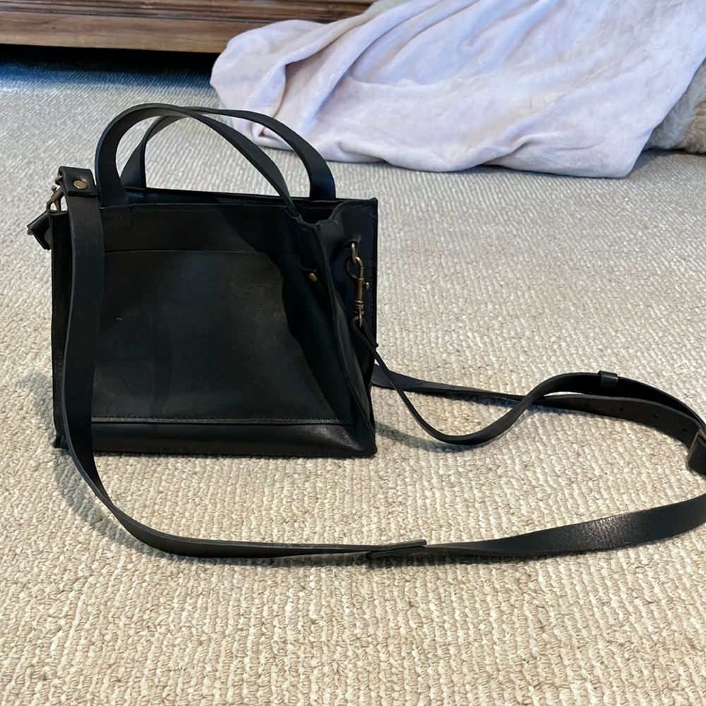 Black crossbody purse from stitch and tickle that is handmade